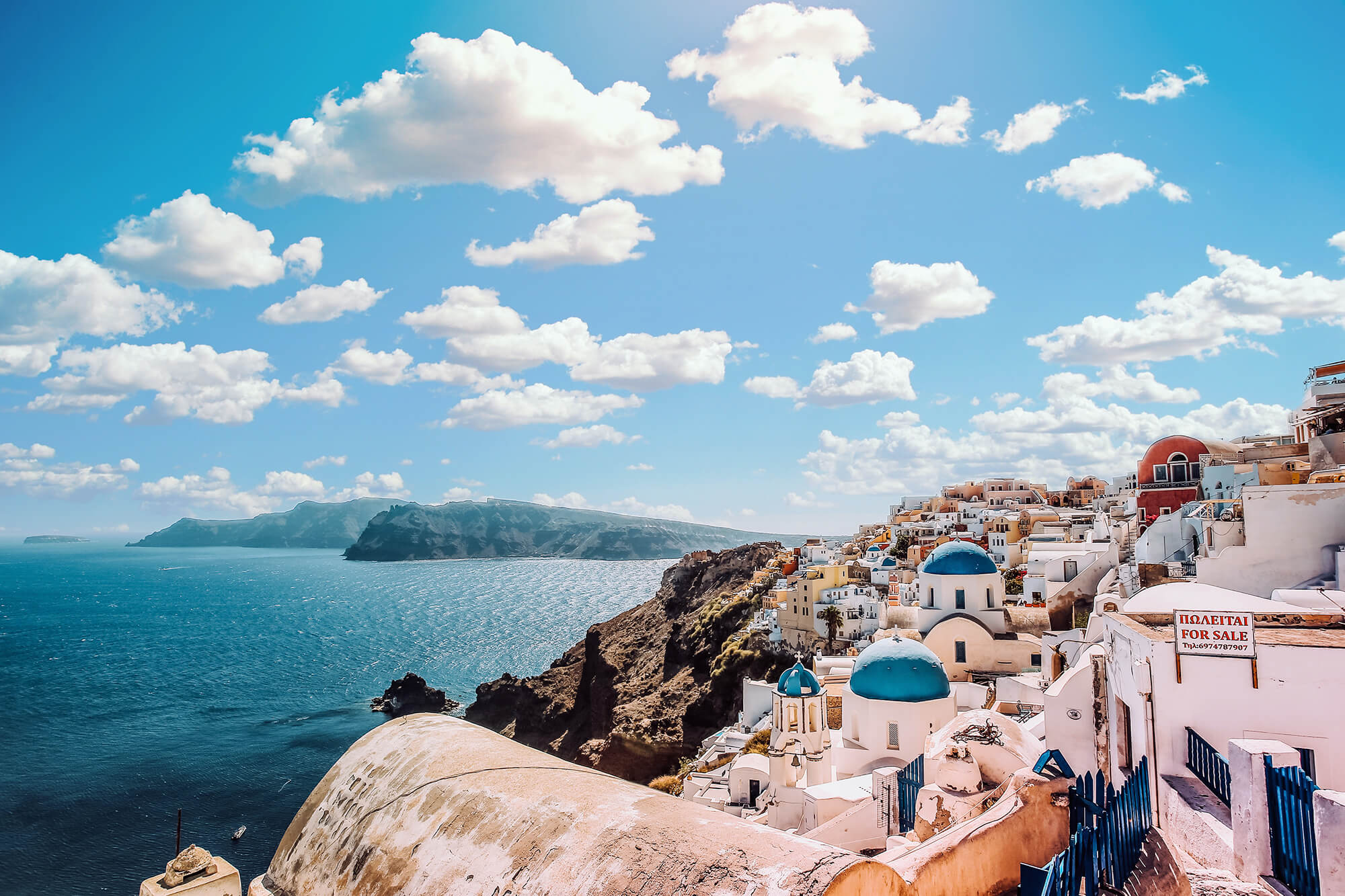 Greece-Golden-Visa-by-the-water-with-clouds